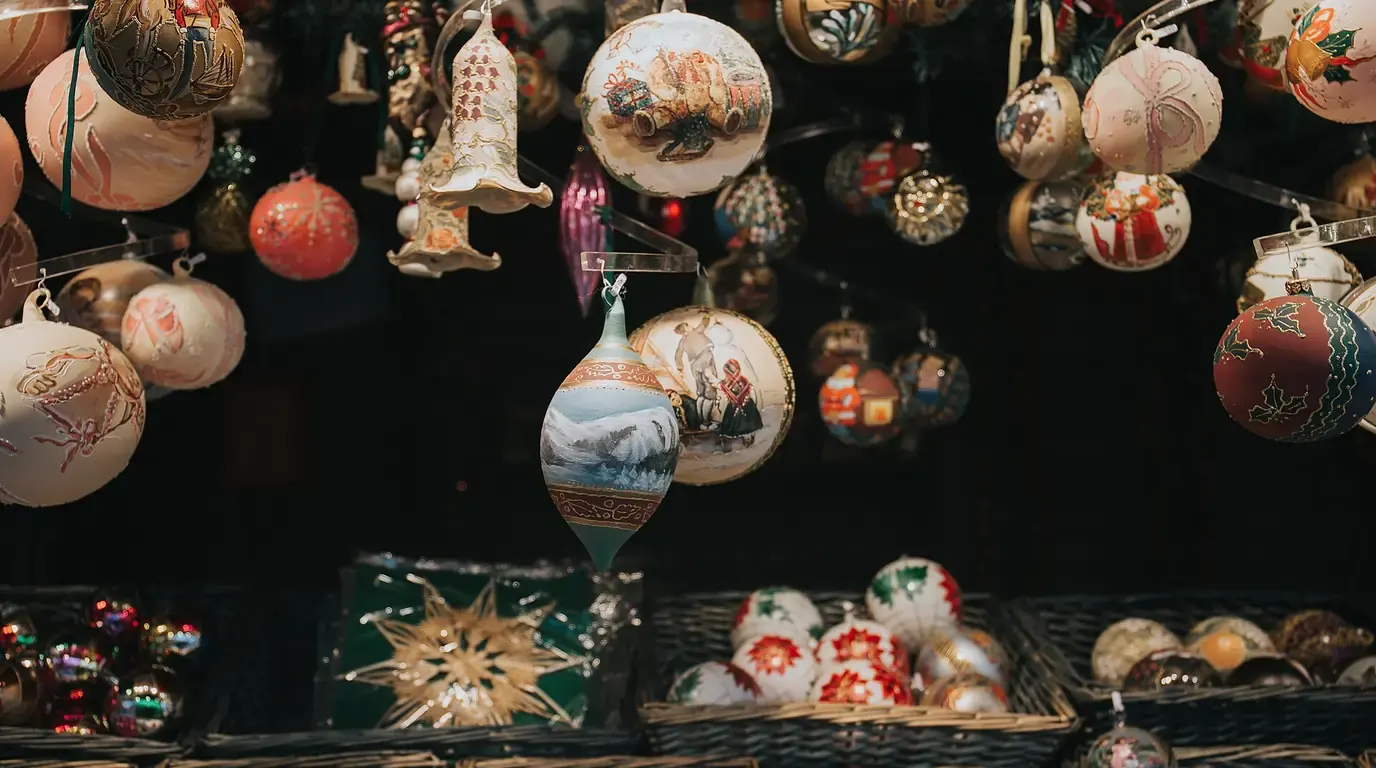 Shelves of hand-painted Christmas baubles and glass ornaments hanging in a market stall